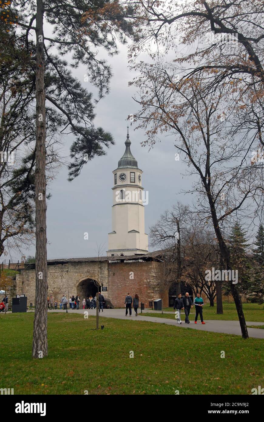 The clock tower in Kalemagdan Park near Belgrade Fortress in Belgrade, Serbia. The tower is part of the Clock Gate and Baroque Gate complex. Stock Photo