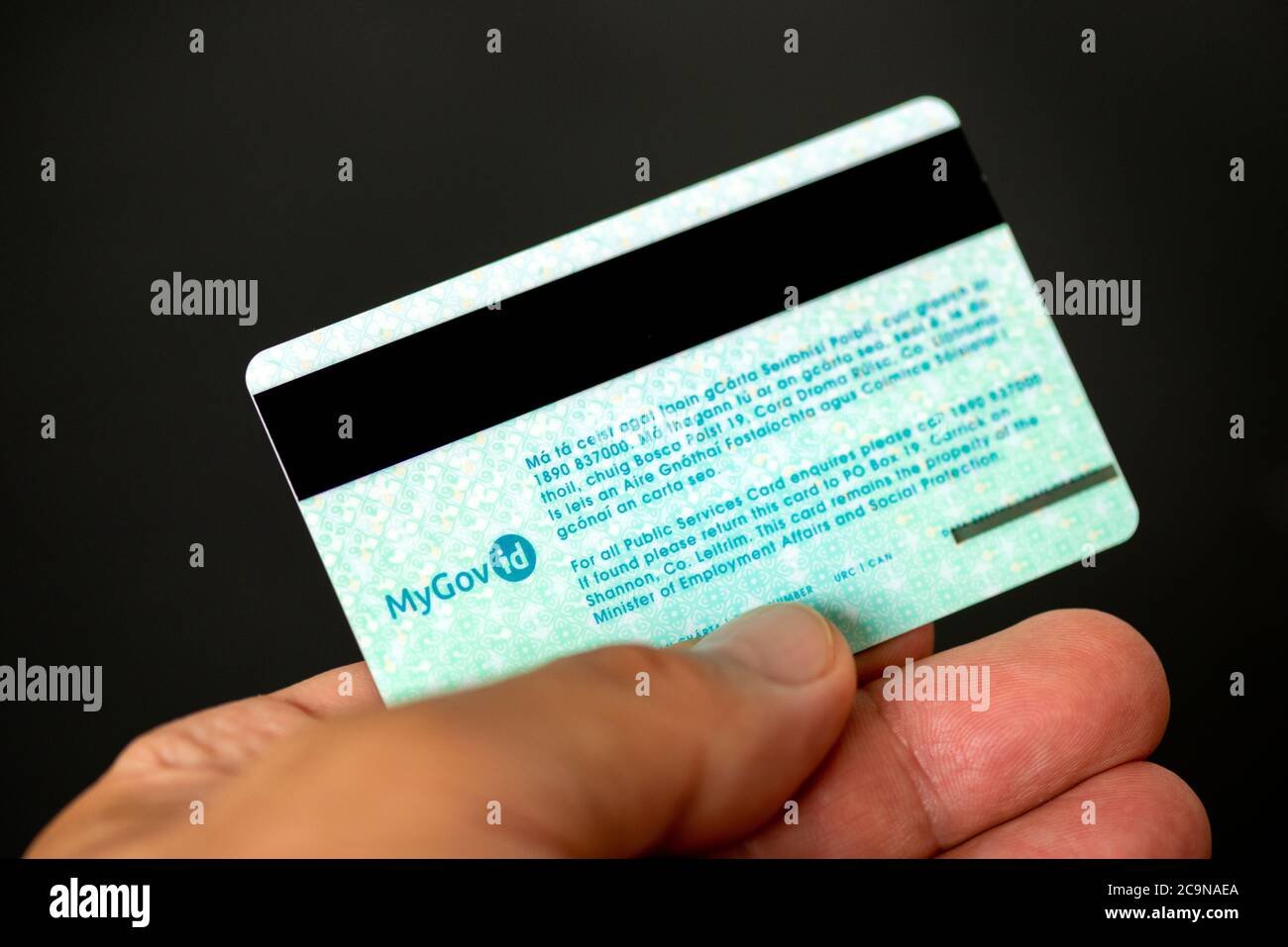 Hand holding Public Services Card Ireland second generation Social Welfare ID valid from 2019 Stock Photo