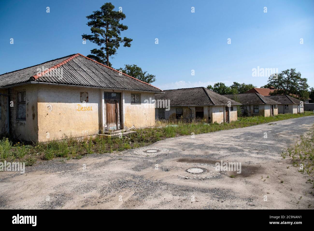 Elstal, Germany. 27th July, 2020. View of the former athletes' accommodation on the grounds of the Olympic Village in Elstal, Brandenburg. Since January 2019, property developer terraplan from Nuremberg has been refurbishing the listed Speisehaus der Nationen including the former boiler house, the future Haus Central. Furthermore, further new residential buildings are being constructed around these buildings. A total of around 365 apartments will be built in the first construction phase until 2022. Credit: Paul Zinken/dpa-Zentralbild/ZB/dpa/Alamy Live News Stock Photo