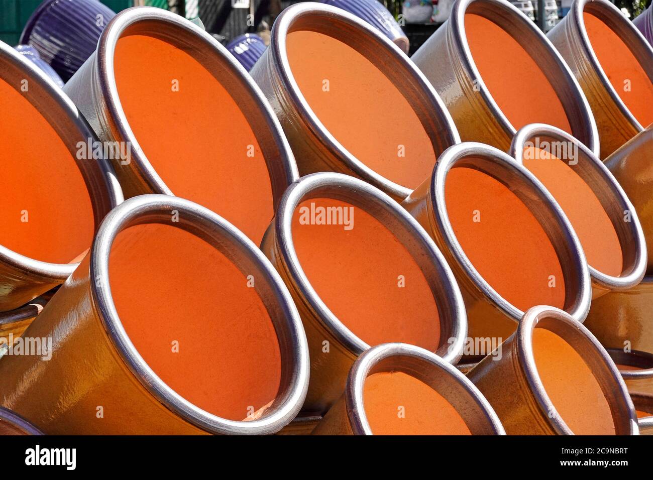 Close up of round repetitive circular shapes formed of large stack of empty flower pots in circles for abstract background pattern image England UK Stock Photo