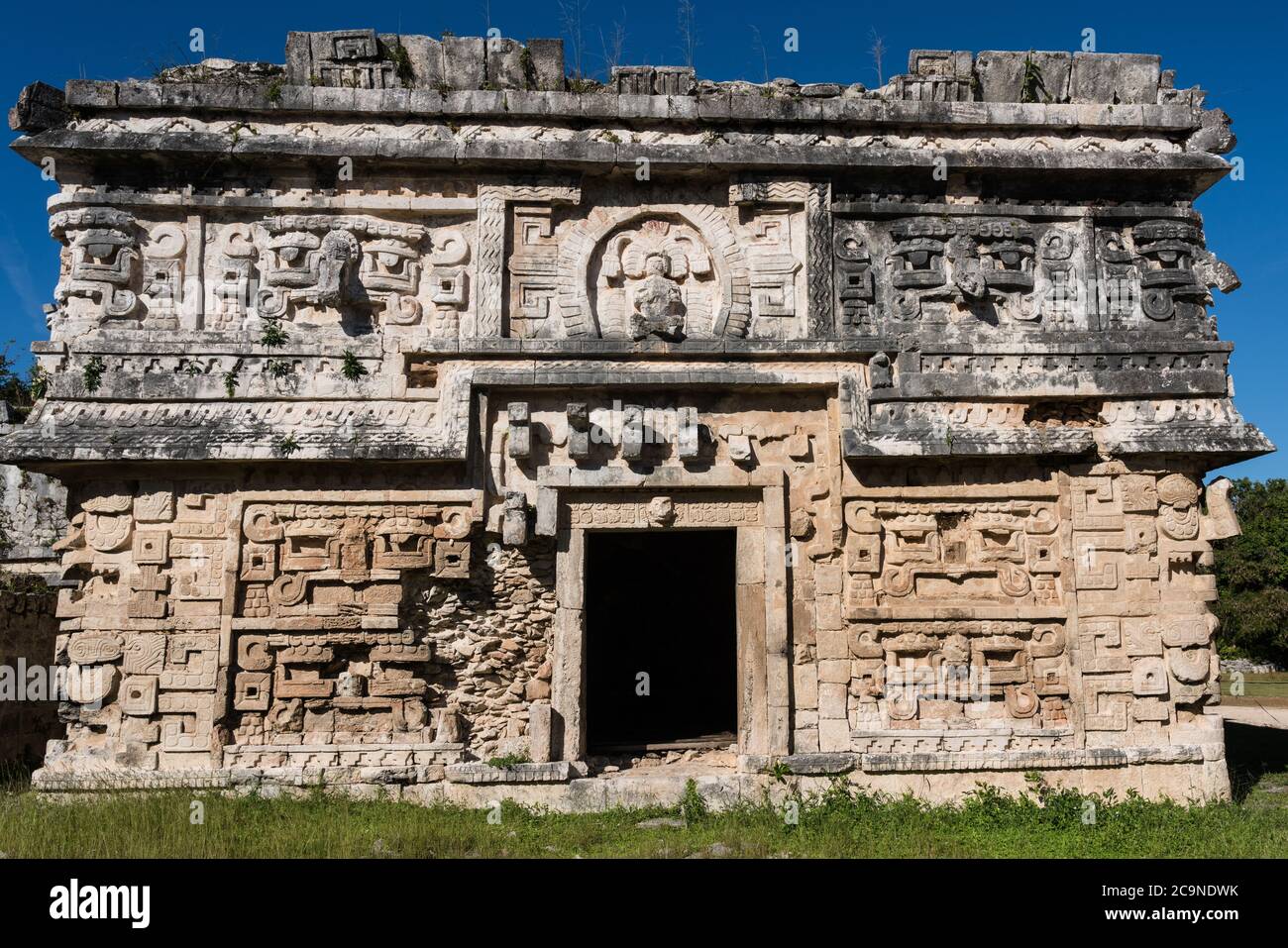 The ornately-carved facade of the Nunnery Complex with several Chaac masks in the ruins of the great Mayan city of Chichen Itza, Yucatan, Mexico. Stock Photo