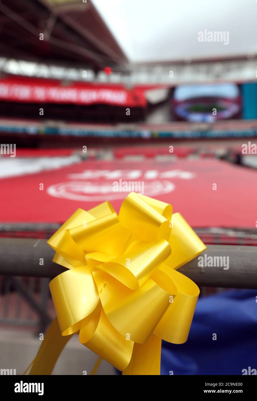 A yellow ribbon in the stands in support of Arsenal ahead of the Heads Up FA Cup final match at Wembley Stadium, London. Stock Photo