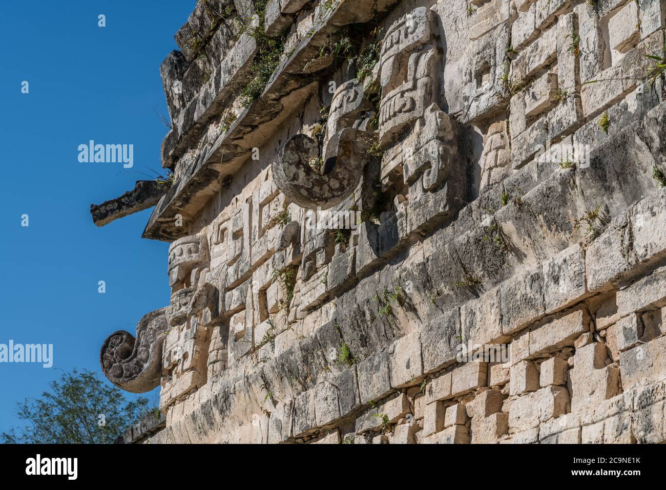 Chaac masks on the facade of the Iglesia or Church in the Nunnery Complex in the ruins of the great  Mayan city of Chichen Itza, Yucatan, Mexico. Stock Photo