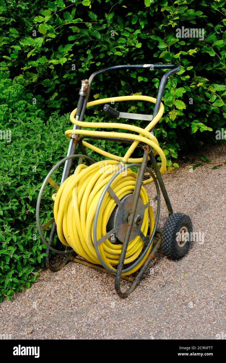 Mobile garden hosepipe - John Gollop Stock Photo