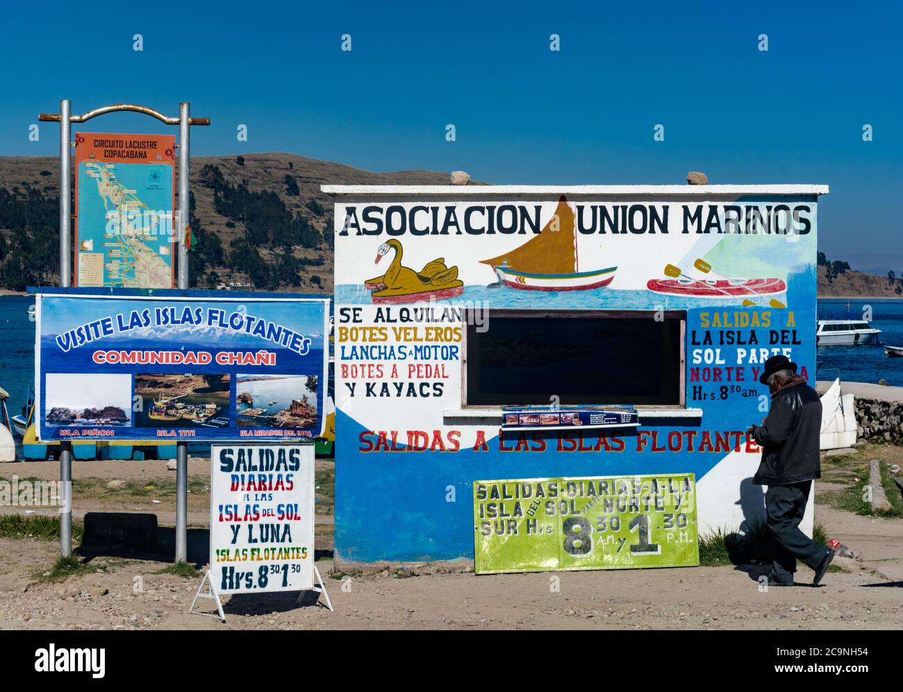 COPACABANA, BOLIVIA - JULY 24, 2016: A man goes to a ferry ticket booth