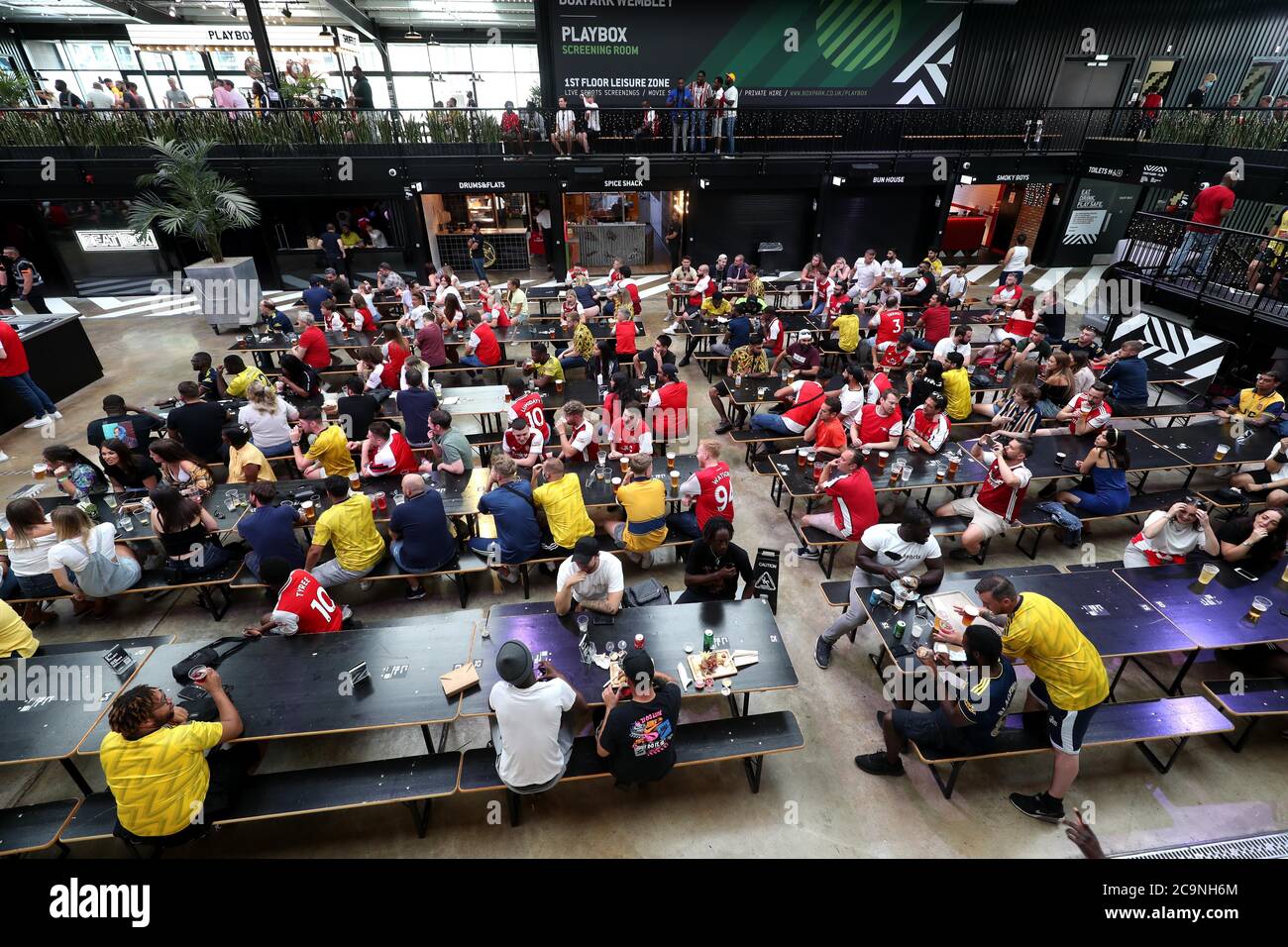 Fans at Box Park Wembley in London, as they watch the FA Cup final between Arsenal and Chelsea at Wembley Stadium Stock Photo