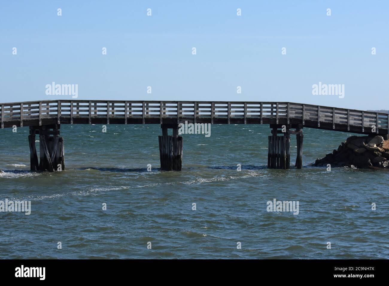 Wood bridge out to a jetty in Plymouth harbor Stock Photo - Alamy