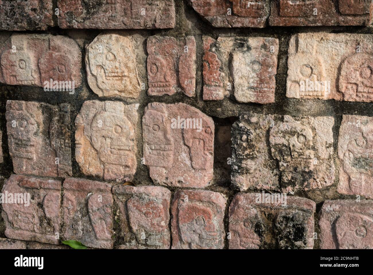 The Platform of the Skulls or the Tzompantli was used to display the skulls of fallen enemies and sacrificial victims in the ruins of Chichen Itza. Stock Photo