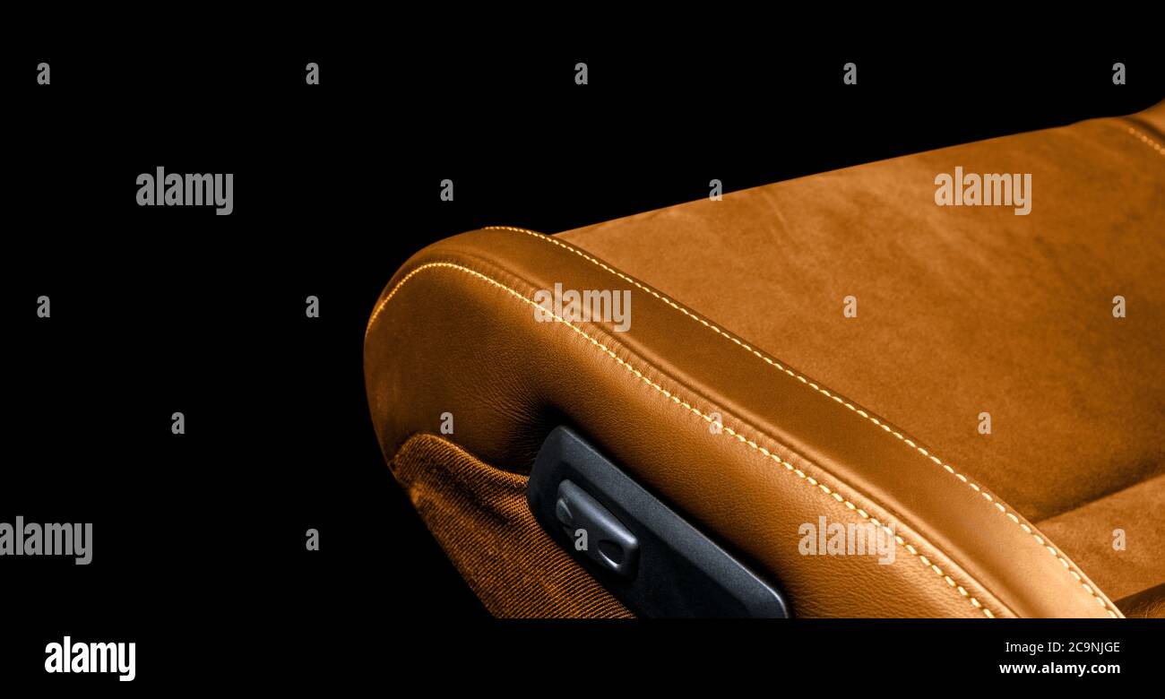 Brown leather interior of the luxury modern car. Perforated brown