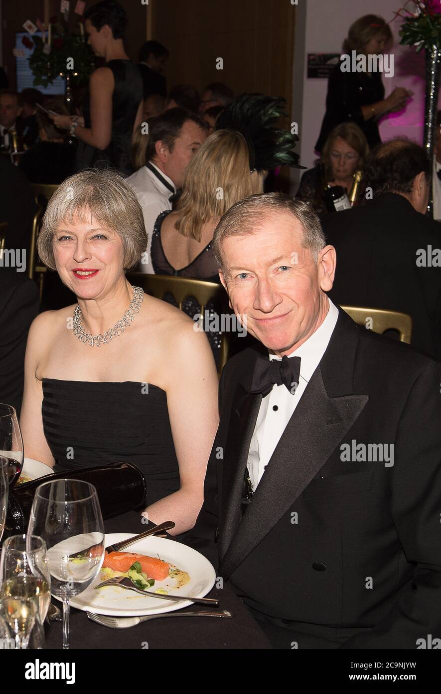 Cookham, Berkshire, UK.  21st November, 2015. Theresa May MP and husband Philip May attend the Cookham Ball at the Odney Club. Credit: Maureen McLean/Alamy Stock Photo
