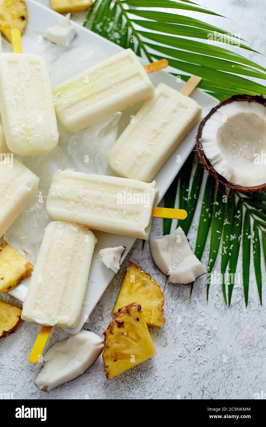 Homemade vegan popsicles made with coconut milk and pineapple