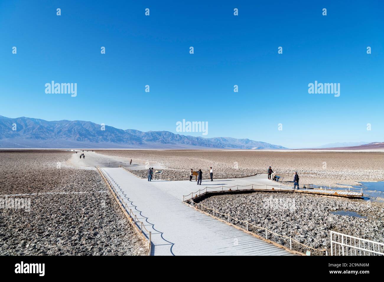 Tourists at Badwater Basin, the lowest point in North America, Death Valley National Park, California, USA Stock Photo
