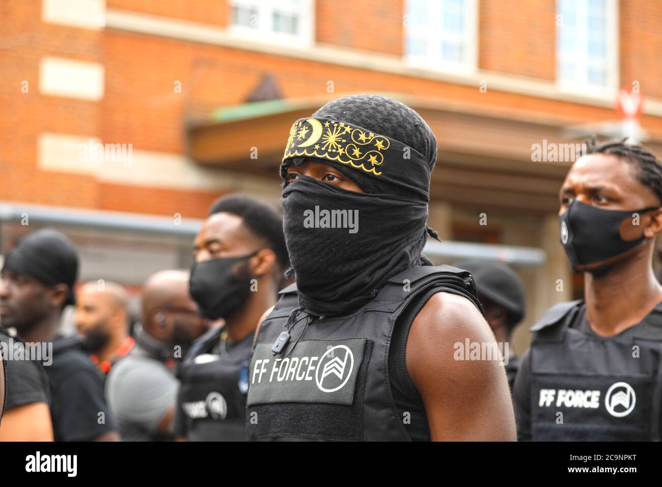 Windrush Square, Brixton, London, 1st August 2020: A newly formed group calling themselves the FF Force AKA Forever Family, marched to Brixton in solidarity wirh Reparation Day. the group were organised, wearing full uniform, their statement of inetent is as follows " We are forever family, united in the battle against racism inequality and injustice".Credit Natasha Quarmby/ ALAMY Live News Stock Photo