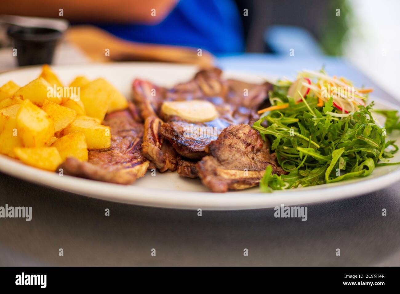 Beef Ribs on plate with potato and vegetables Stock Photo