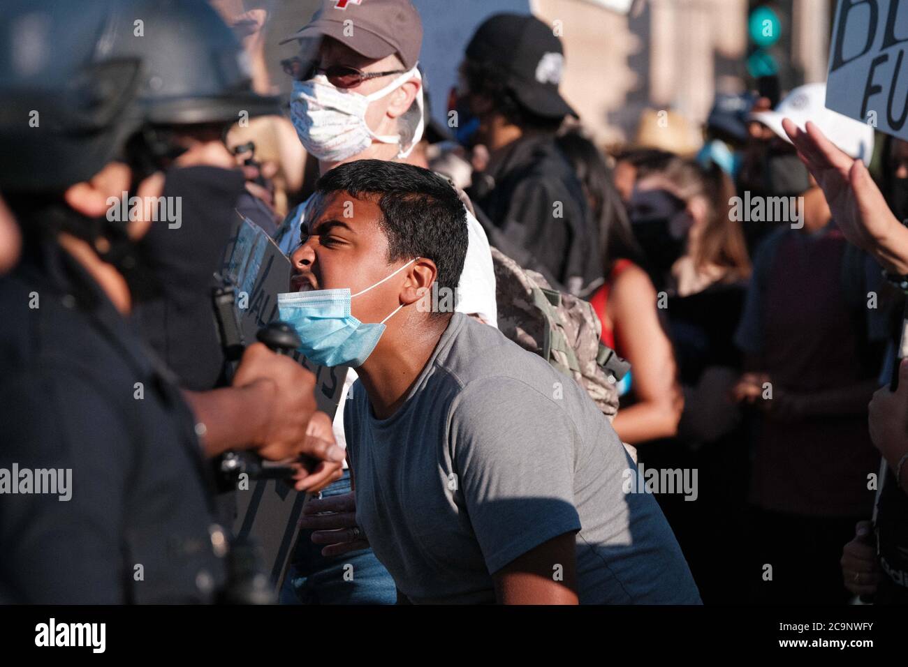 3. Protestor at the entrance of the 101 freeway. LAPD had formed a line, blocking only one side of the ramps. Stock Photo