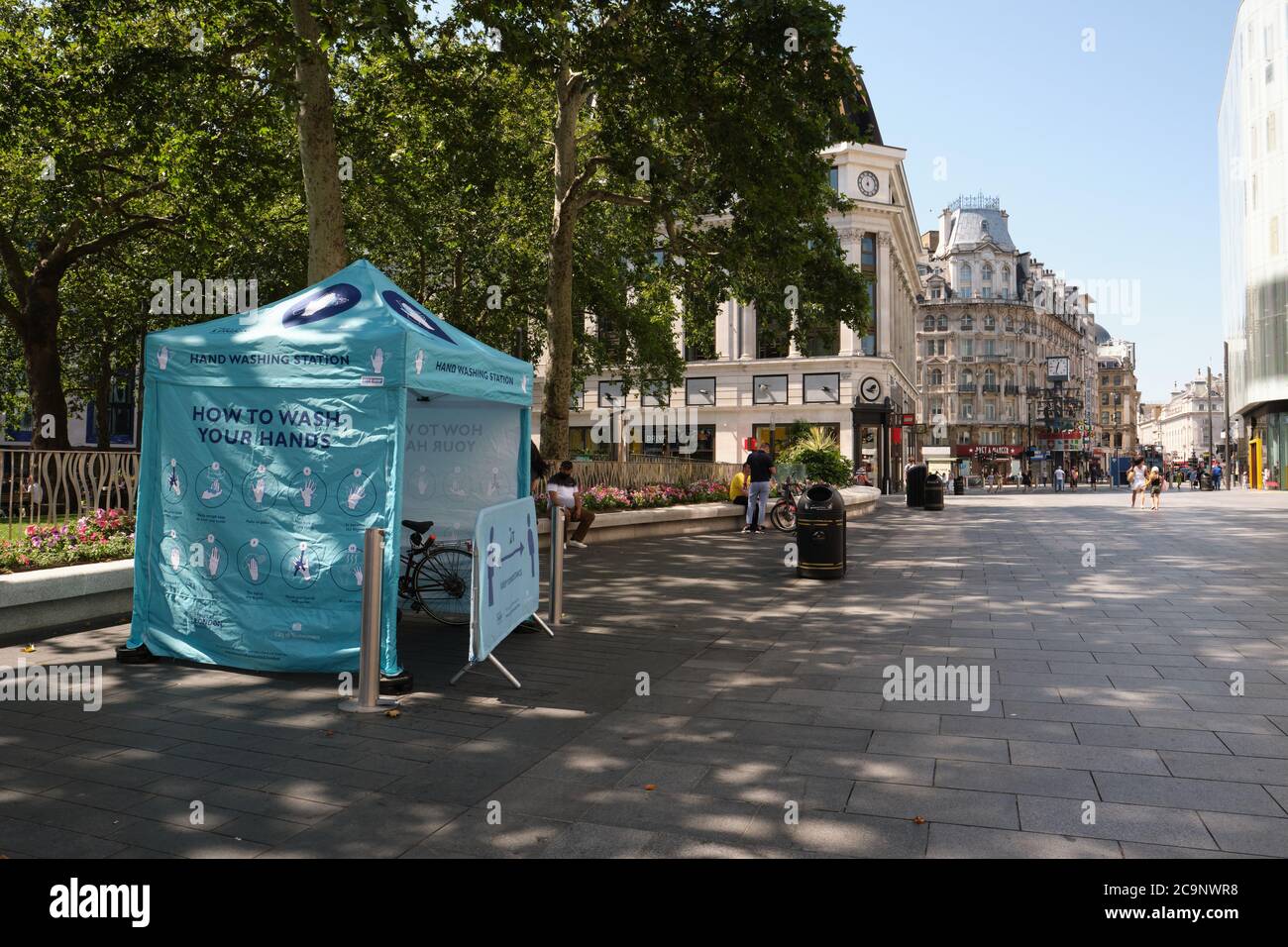 Hand Washing Station at Leicester Square in London, UK to provide free masks, gloves and hand sanitizer to the public amid COVID-19 pandemic. Stock Photo