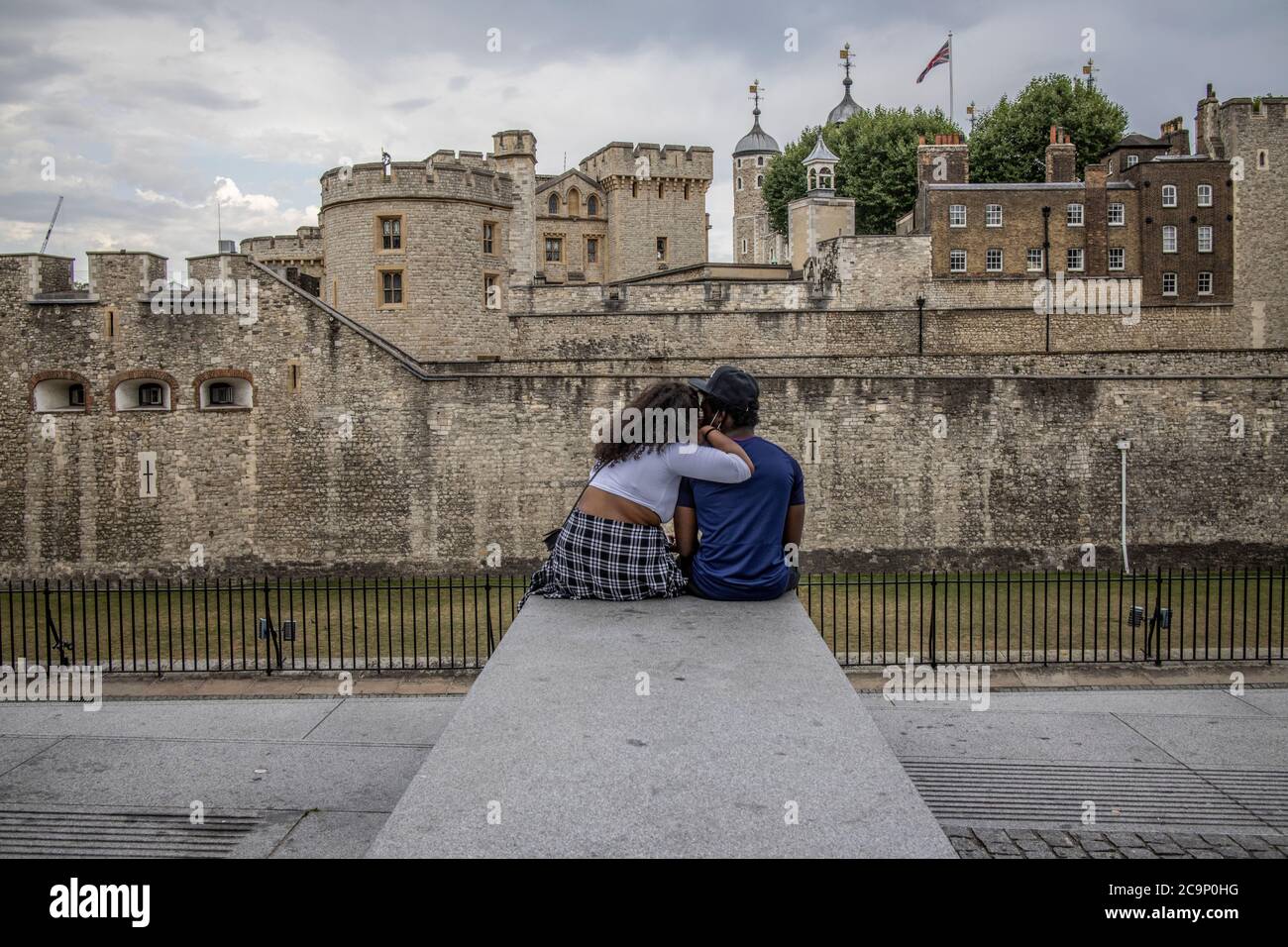 Tourists enjoying the near emptiness around the usually busy tourist area of Tower of London on a Friday afternoon, post coronavirus lockdown, UK Stock Photo