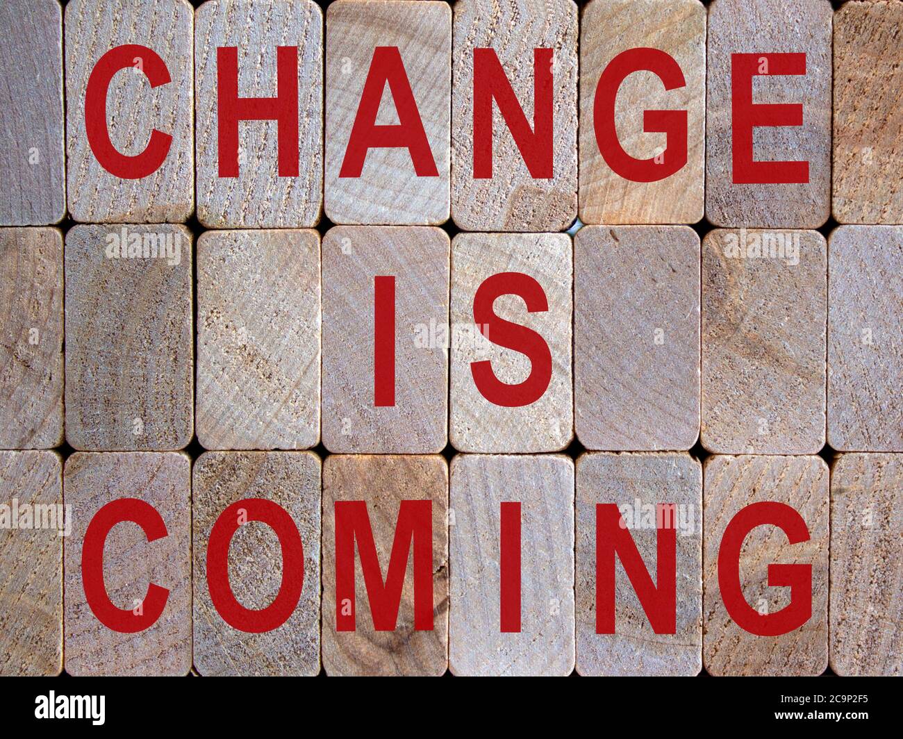 Wooden blocks form the words 'change is coming'. Beautiful wooden