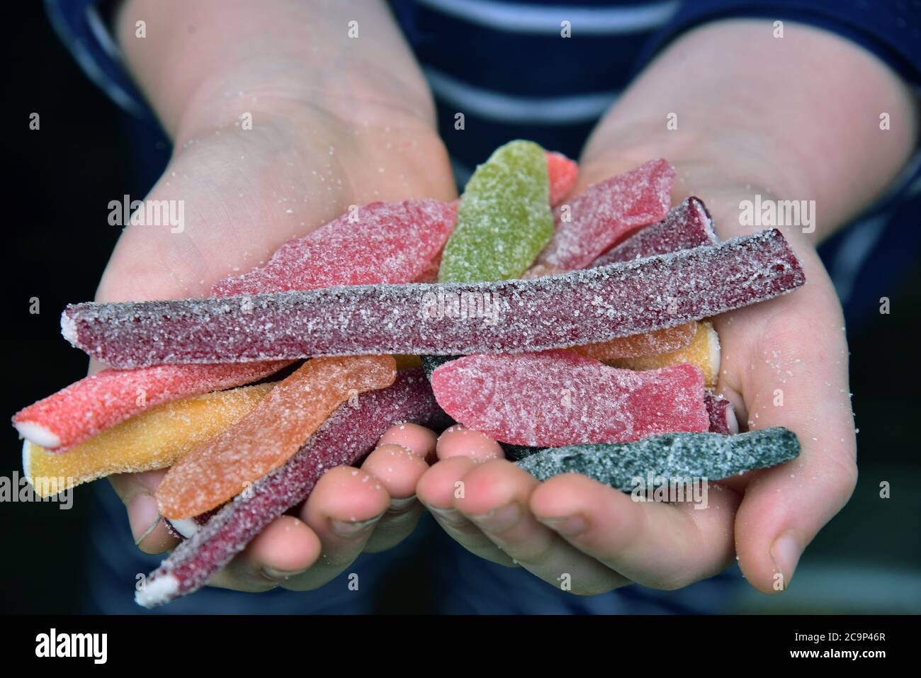 Pictures show Soft Jellies Fizzy Fish sweets made by Maynards Bassetts and Fizzy Rainbow Pencils. Both sweets contain more than 20% of sugar Stock Photo