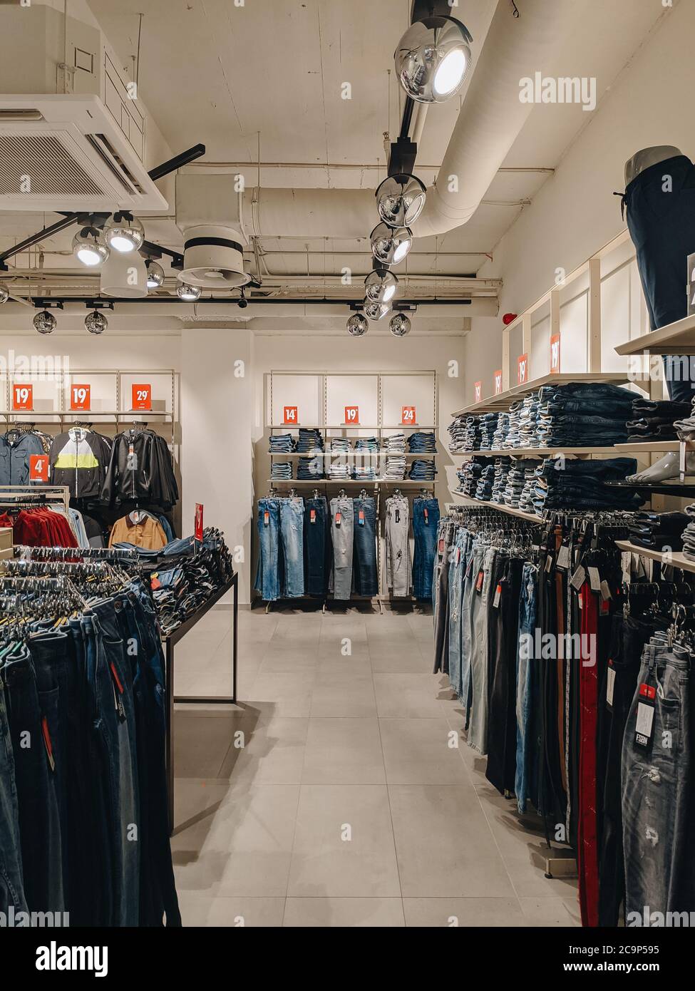 Budva, Montenegro - 01 august 2020: Jeans in the store. The goods are on the shelves. Stylish fashion boutique. Stock Photo