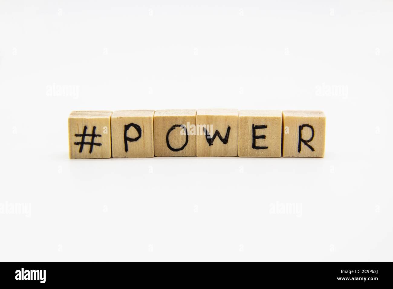 A word power with hashtag. Wooden small cubes with letters isolated on white background with copy space available. Concept image with hashtag. Stock Photo