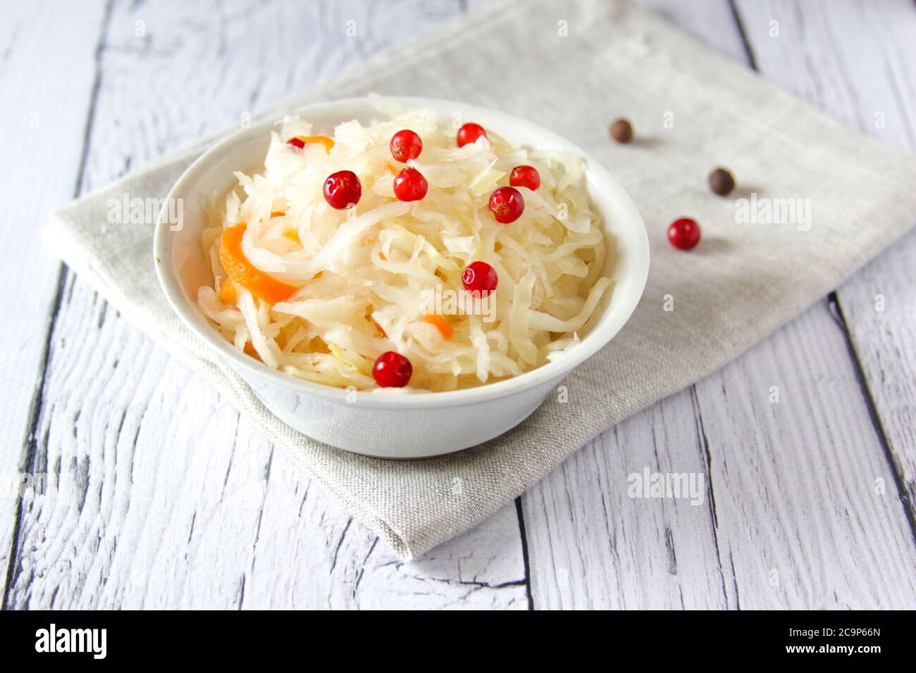 Sauerkraut is fermented cabbage with red cranberry including vitamins C