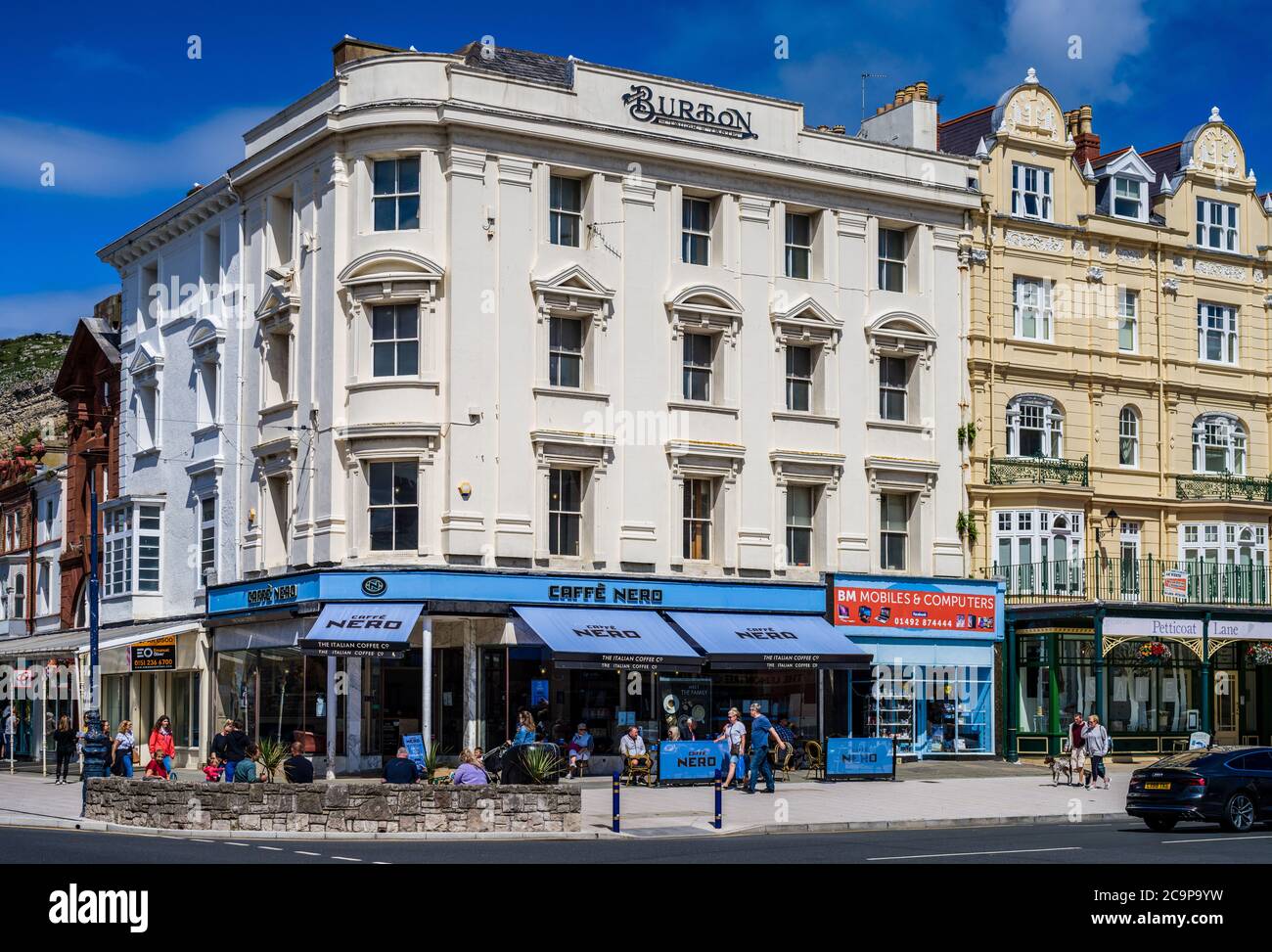 Caffe Nero coffee shop in a former Burton Menswear store sign of a changing High Street. High Street Shop Reuse. Town Centre Building Reuse. Cafe Nero Stock Photo