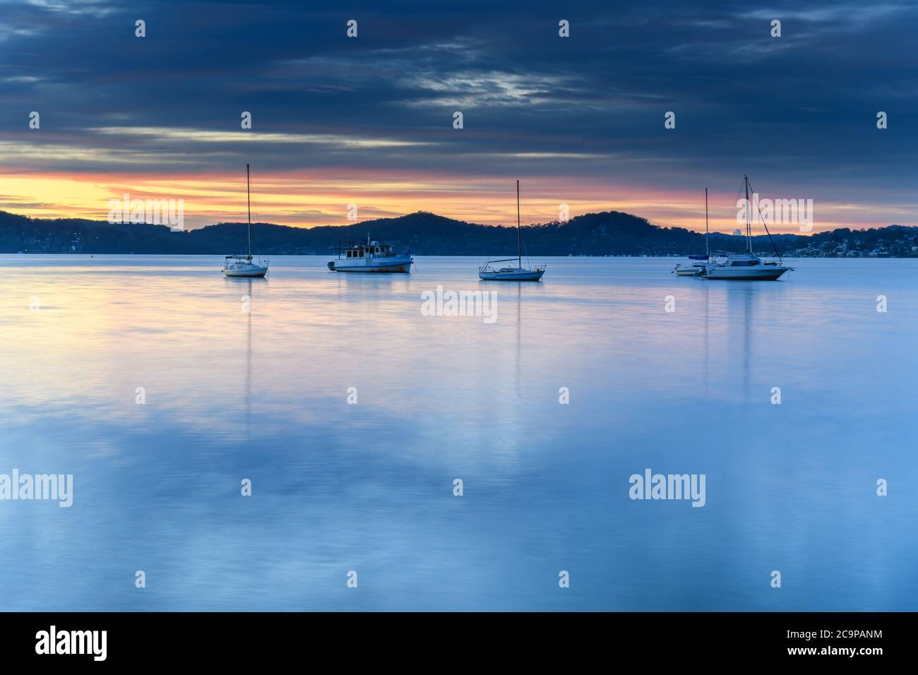 Colourful Clouds and Sunrise from Koolewong Waterfront on the Central Coast, NSW, Australia. Stock Photo