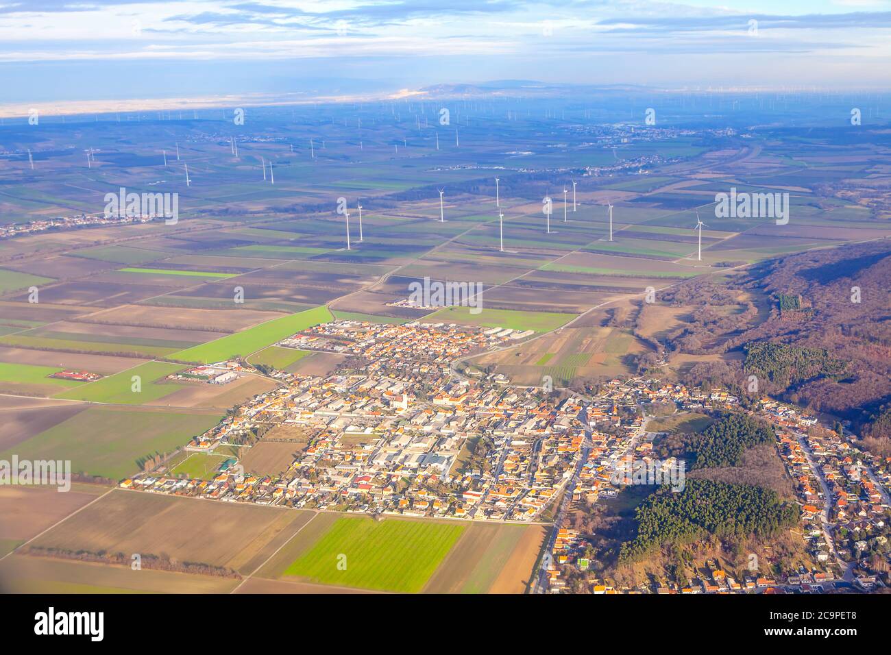 Sommerein town in Austria aerial view . District of Bruck an der Leitha in Lower Austria . View of Vienna suburb with windmills farm Stock Photo