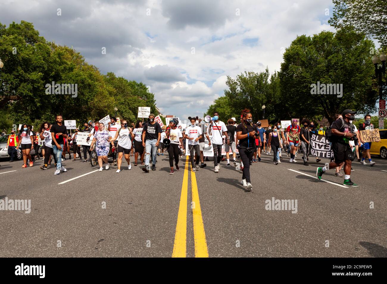 Washington, DC, USA. 1st Aug, 2020. Pictured: Demand DC protesters walk down Constitution Avenue during a march hosted by The Palm Collective. Protesters are demanding four changes from city government: police-free schools, an end to qualified immunity for police officers, a new public safety department, and designation of election day as a holiday. Credit: Allison C Bailey/Alamy Credit: Allison Bailey/Alamy Live News Stock Photo