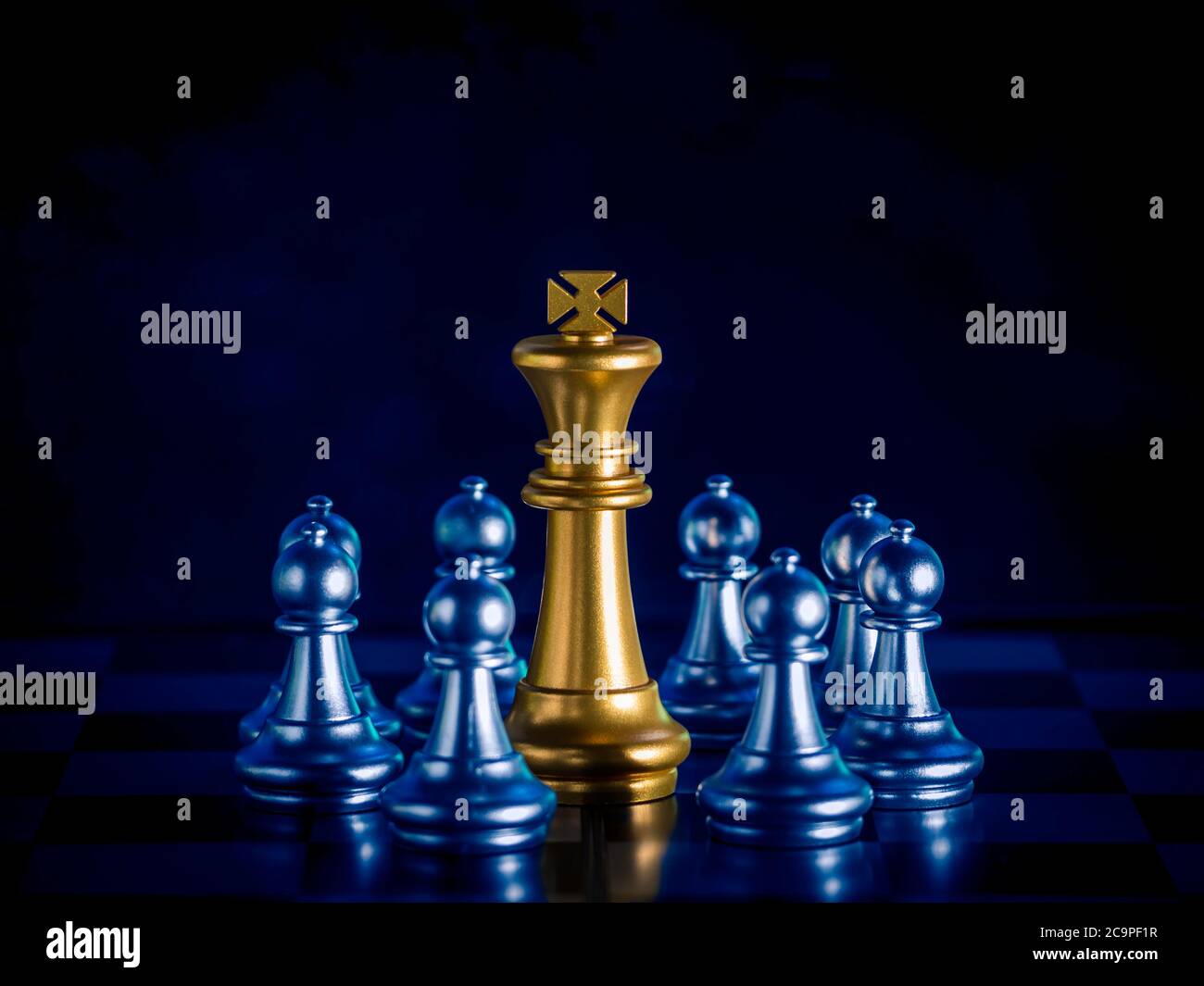 Golden Chess King In Front Of A Checkered Board Stock Photo