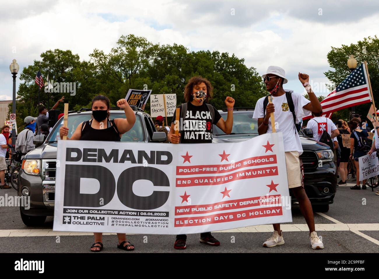 Washington, DC, USA. 1st Aug, 2020. Pictured: Protest leaders in position holding the banner to begin the Demand DC march, hosted by The Palm Collective. Protesters are demanding four changes from city government: police-free schools, an end to qualified immunity for police officers, a new public safety department, and designation of election day as a holiday. Credit: Allison C Bailey/Alamy Credit: Allison Bailey/Alamy Live News Stock Photo