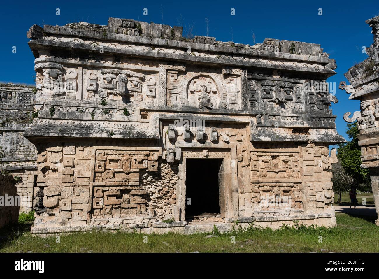 The ornately-carved Chenes-style facade of the entrance to the Nunnery Complex in the ruins of the great Mayan city of Chichen Itza, Yucatan, Mexico. Stock Photo