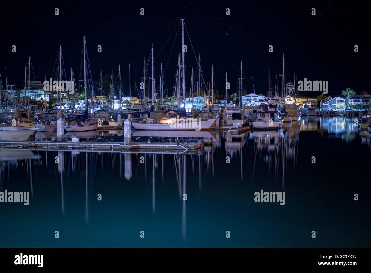 Night shot of boats in their slips on a tranquil night at Marina Real in in the Sea of Cortez, San Carlos, Sonora, Mexico. Stock Photo