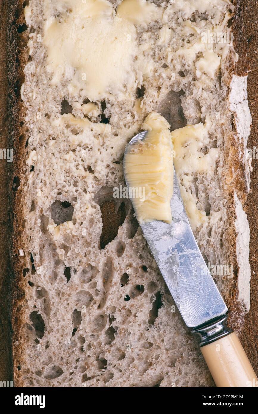Sourdough bread with a knife and butter Stock Photo