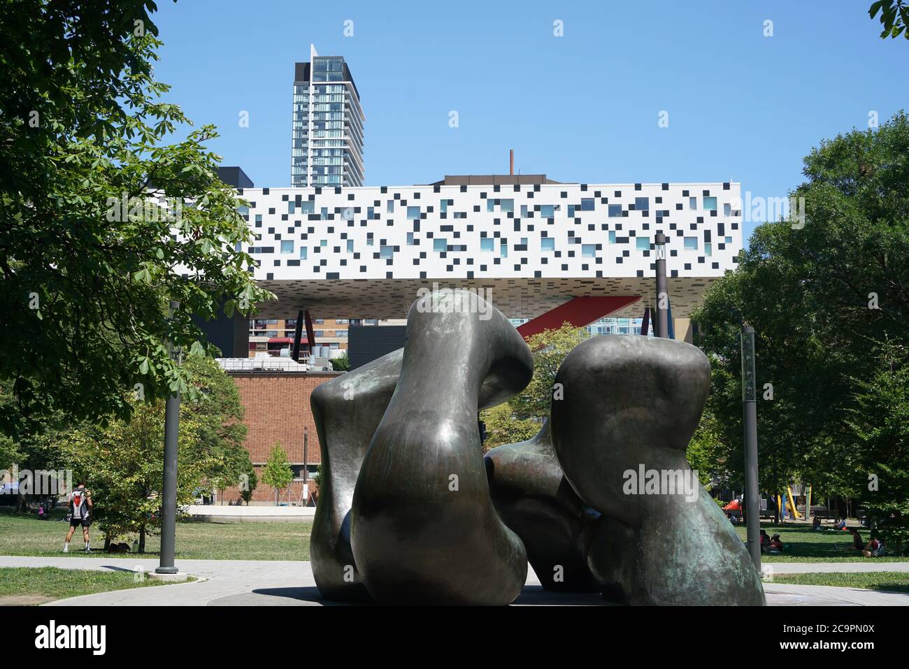 Toronto, Canada - July 31, 2020: Grange Park, with a sculpture by Henry Moore, and the Ontario College of Art and Design in the background Stock Photo