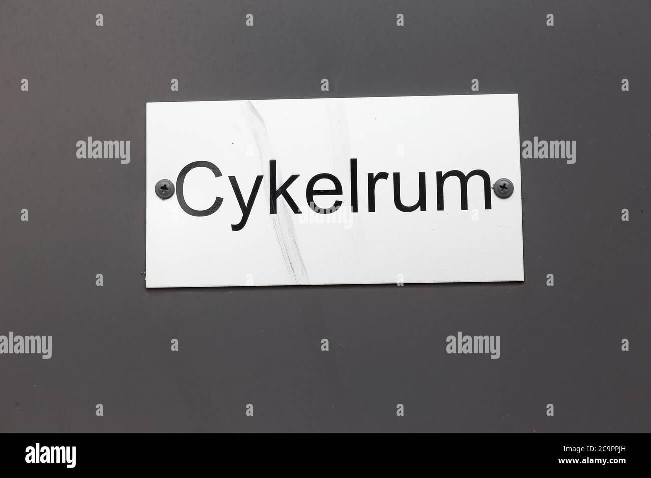 Close-up of a Swedish language bicycle storage room sign. Stock Photo