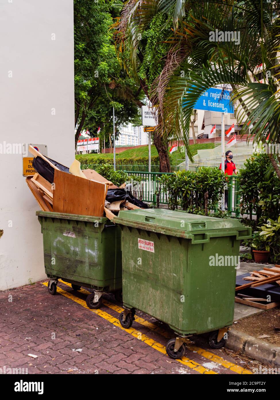 SINGAPORE – JUL 31, 2020 – Dumpsters full of rubbish and trash at Sin Ming residential estate in Singapore Stock Photo
