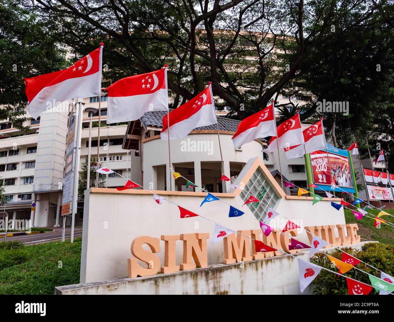 SINGAPORE – JUL 31, 2020 – Row of Singapore national flags placed at Sin Ming HDB residential estate in preparation for National Day Stock Photo