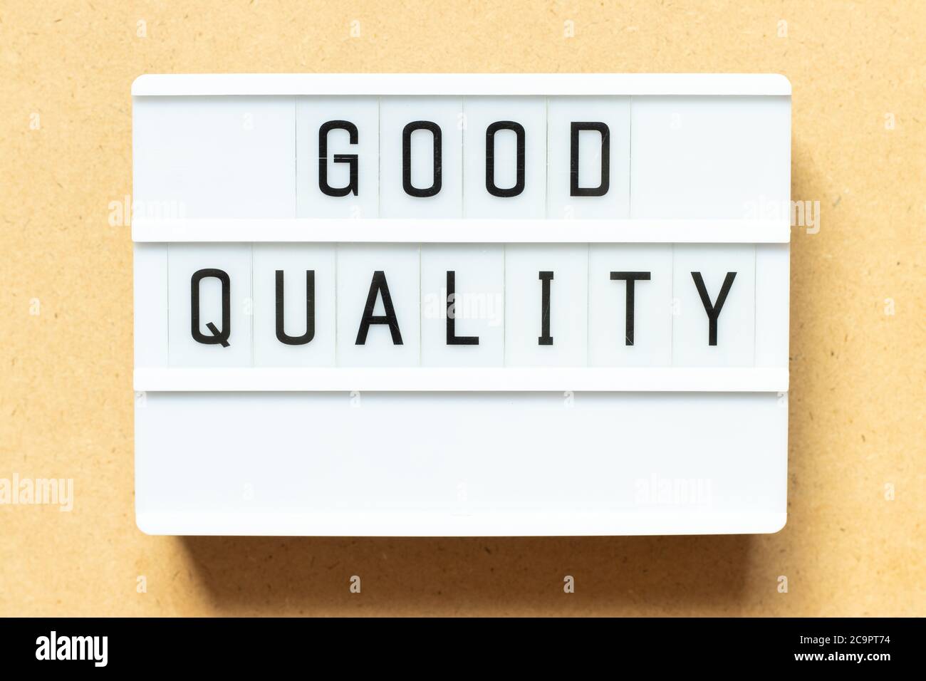 Lightbox with word good quality on wood background Stock Photo