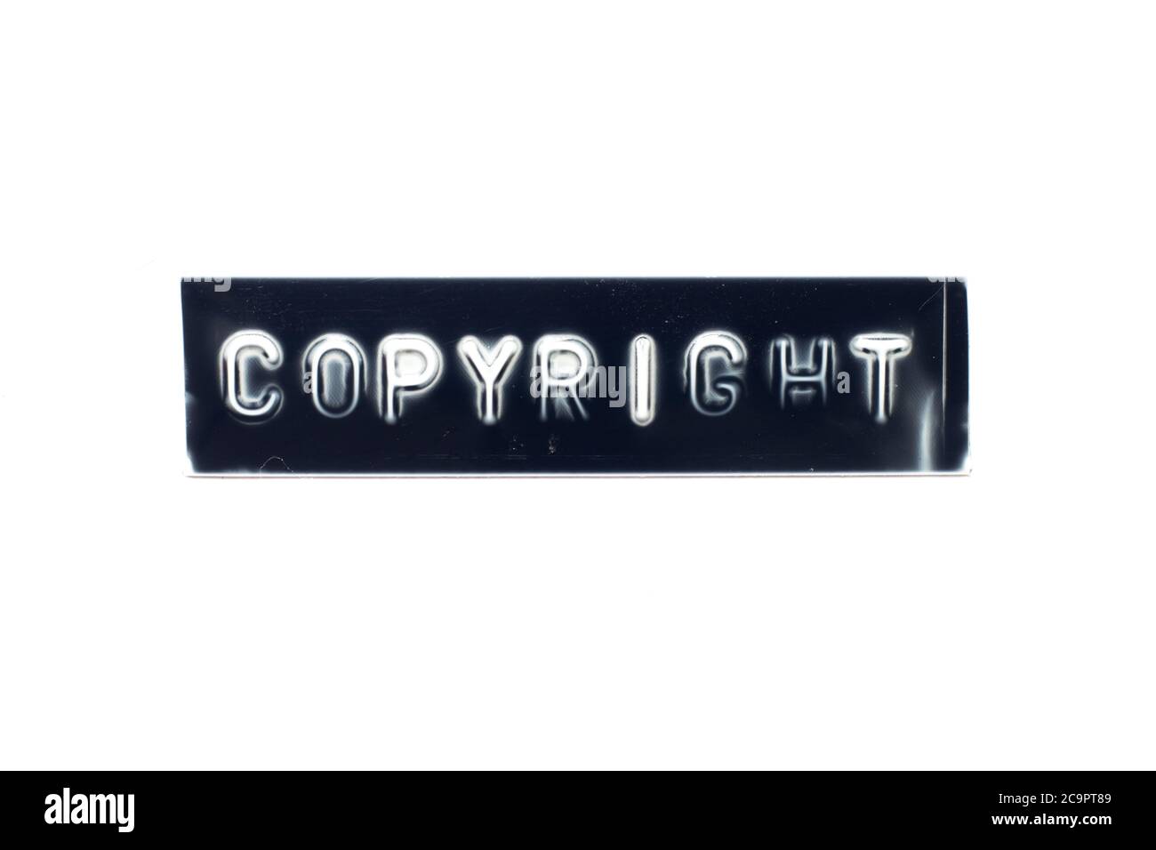 Embossed letter in word copyright on black banner with white background Stock Photo