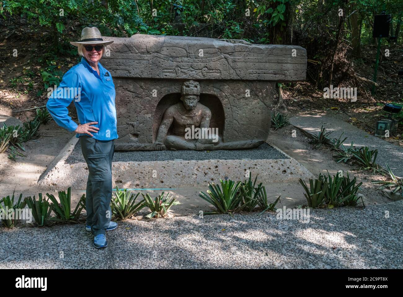 A tourist at Altar 4, the Triumphal Altar, from the Olmec ruins of La