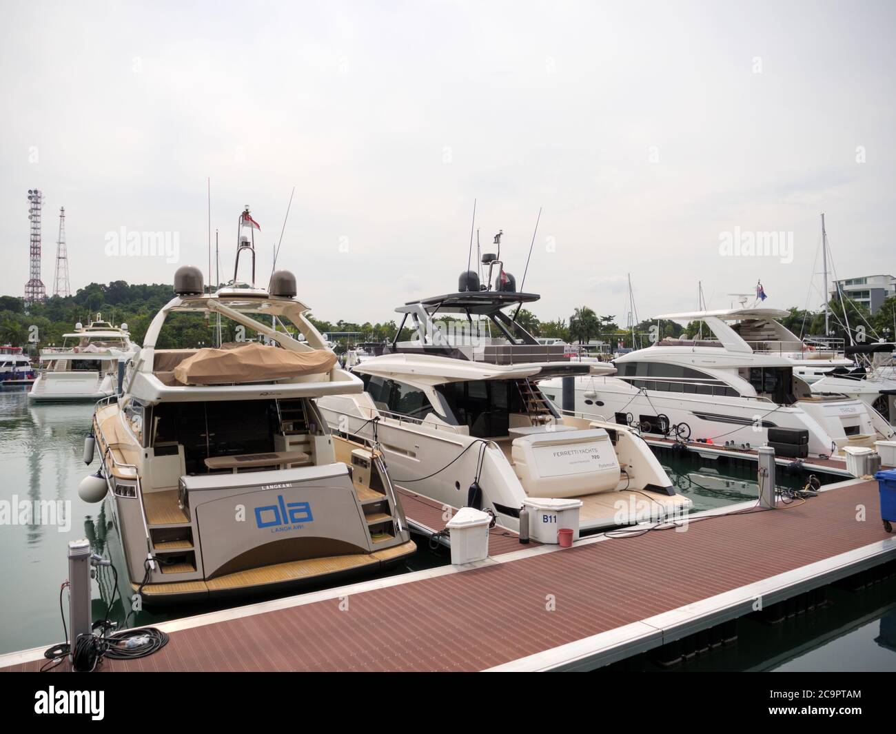 SINGAPORE – JUL 31, 2020 – Luxury recreational boats docked at Sentosa Cove Quayside Isle at Sentosa Island, Singapore Stock Photo