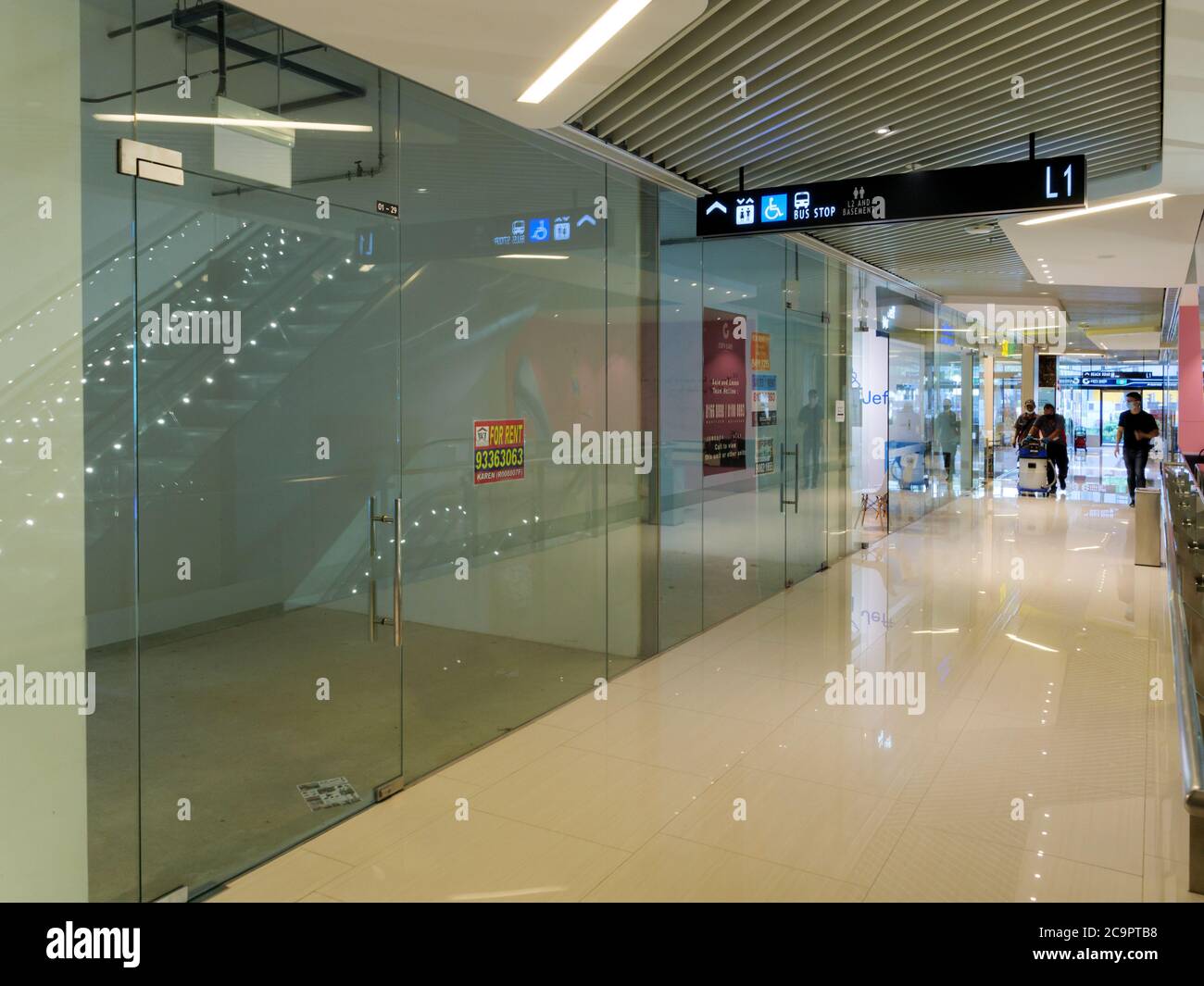 SINGAPORE – JUN 17, 2020 – Empty retail outlets with “For Rent” signs at the deserted City Gate shopping mall in downtown Singapore Stock Photo