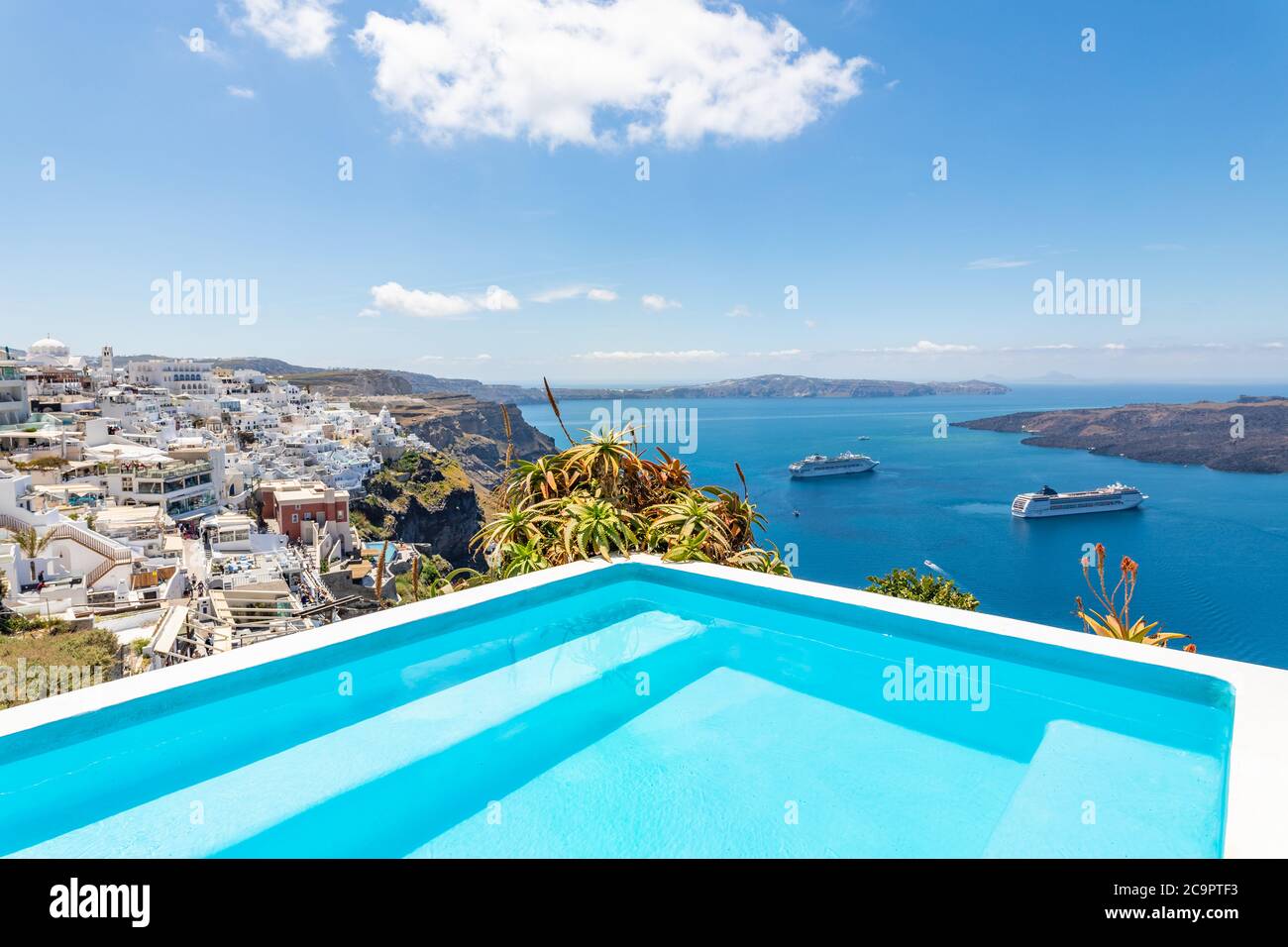 Luxury summer travel and vacation landscape. Swimming pool with sea view. White architecture on Santorini island, Greece. Beautiful landscape with sea Stock Photo