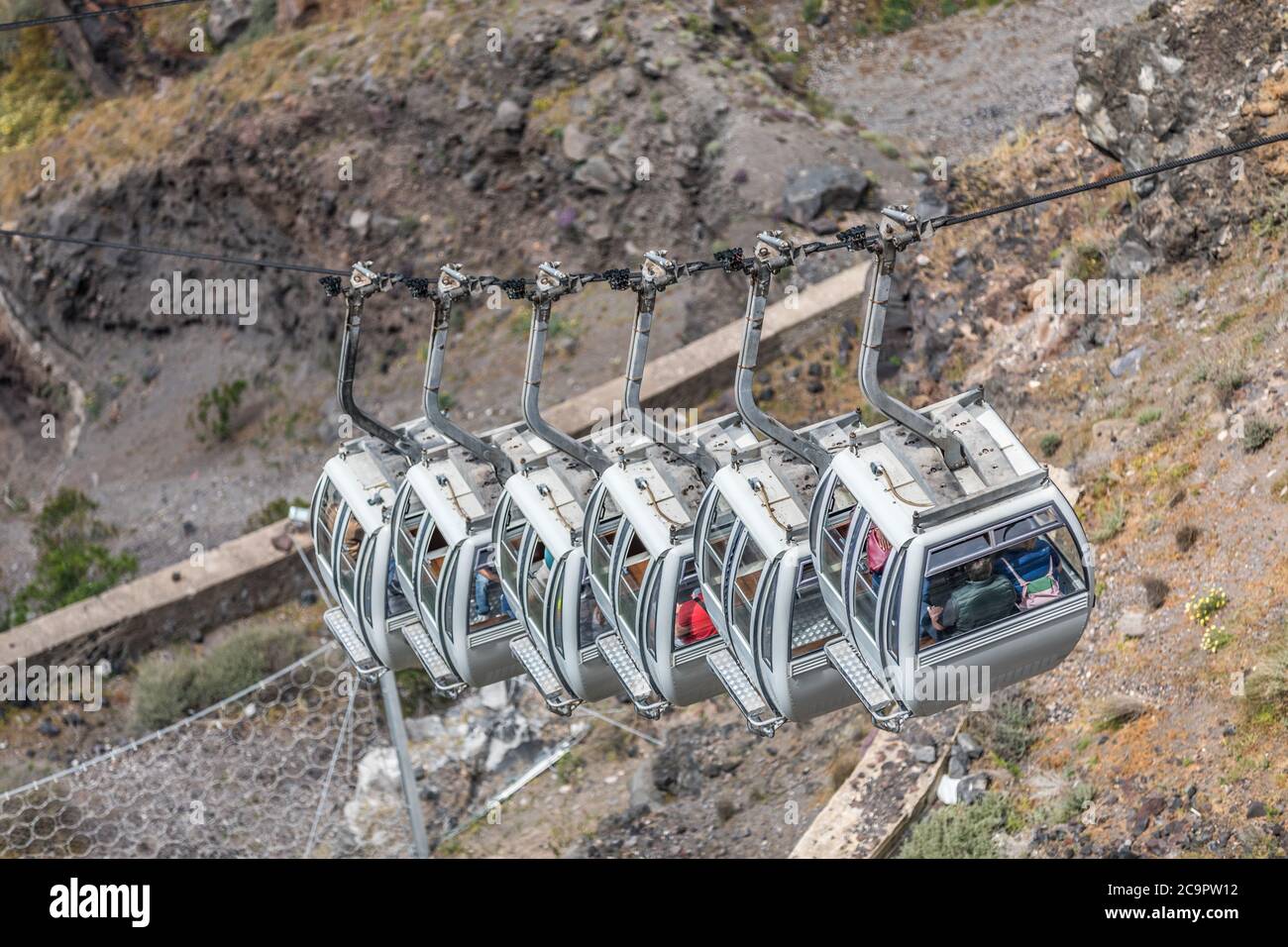 Santorini cable car, transporting tourist above the cliffs to Fira port. Summer vacation Stock Photo