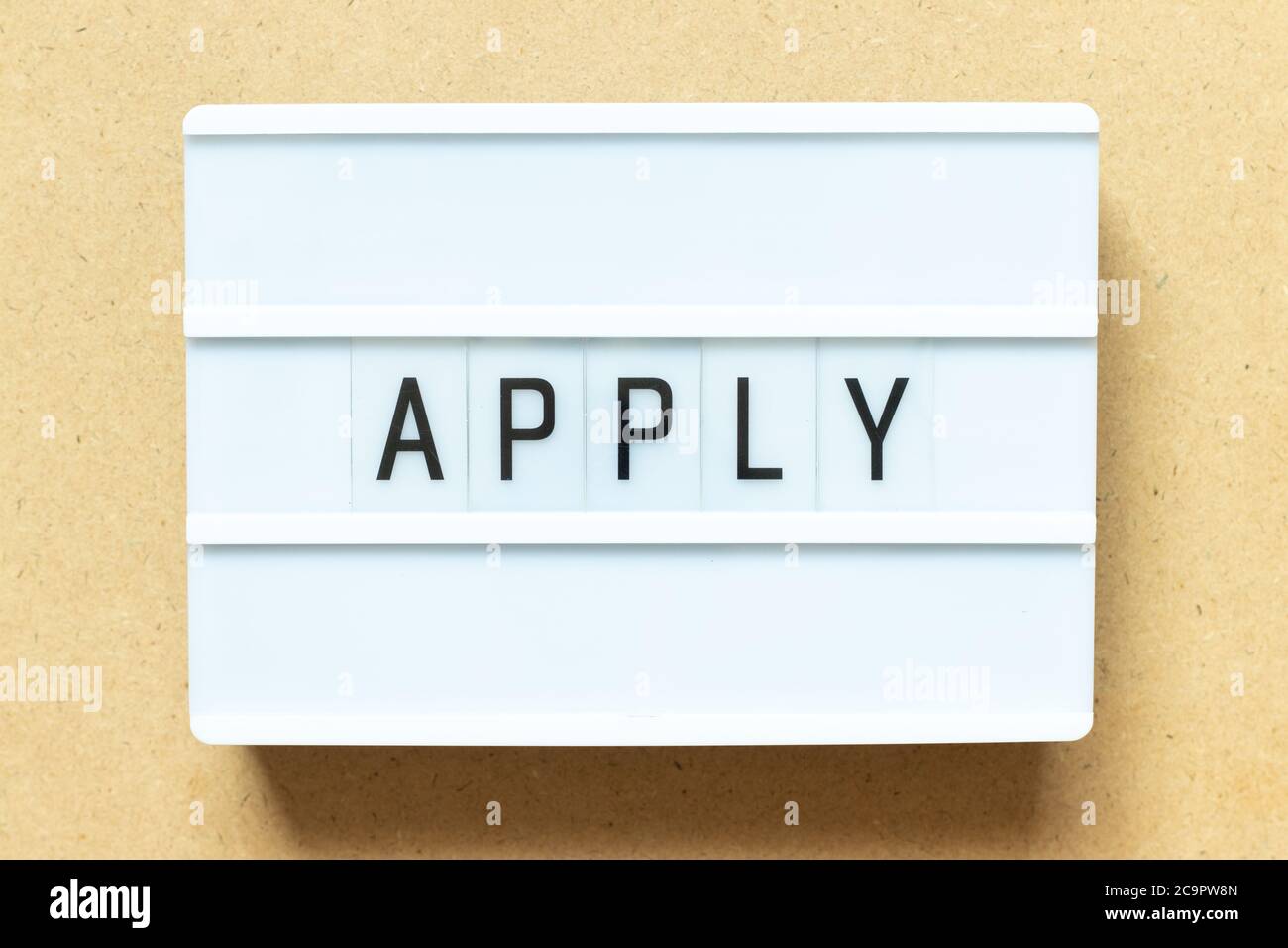Lightbox with word apply on wood background Stock Photo