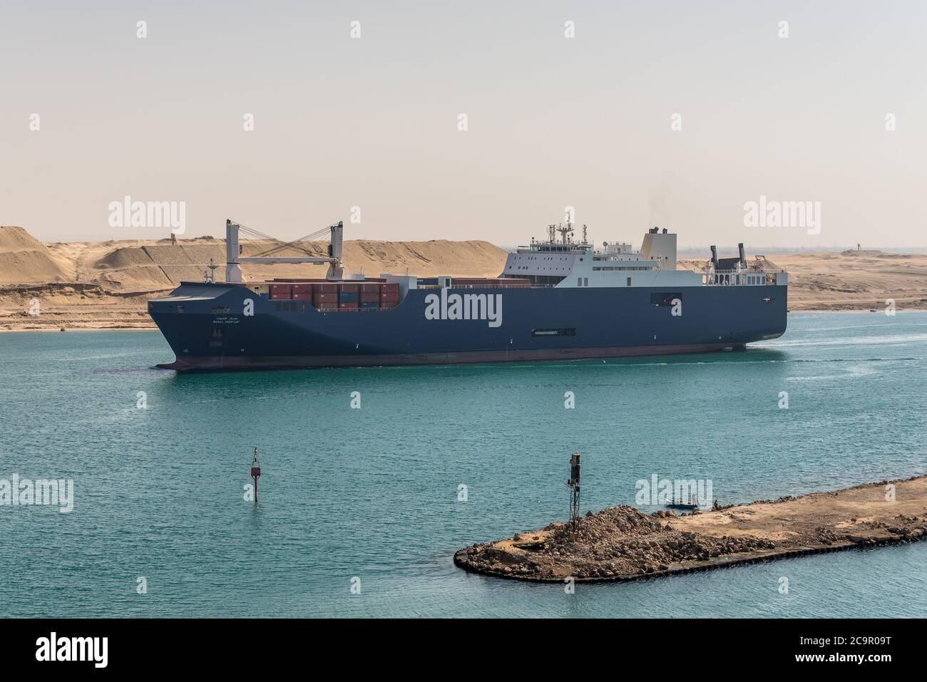Suez, Egypt - November 14, 2019: Ro-Ro Cargo vessel BAHRI HOFUF passing Suez Canal in Egypt. The Suez Canal is an artificial sea-level waterway, conne Stock Photo