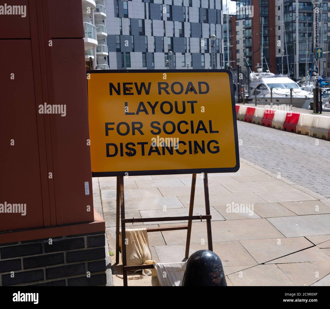 Sign for new road layout for social distancing, Wet Dock waterfront, Ipswich, Suffolk, England, UK July 2020 Stock Photo