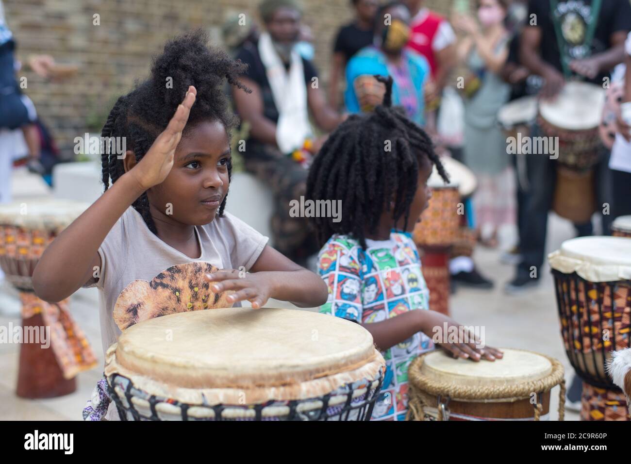 Hundreds join the Afrikan Emancipation Day celebration on Windrush Square, Brixton. As roads were temporary blocked has part of the 'Lockdown Brixton'. Stock Photo